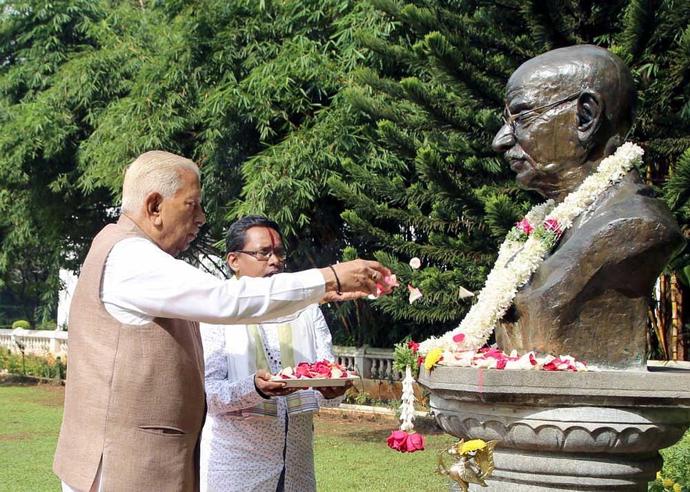 Governor Vajubhai Vala garlands the statue of Mahatma Gandhi on the premises of Raj Bhavan, on the occasion of Gandhi Jayanthi on Monday.