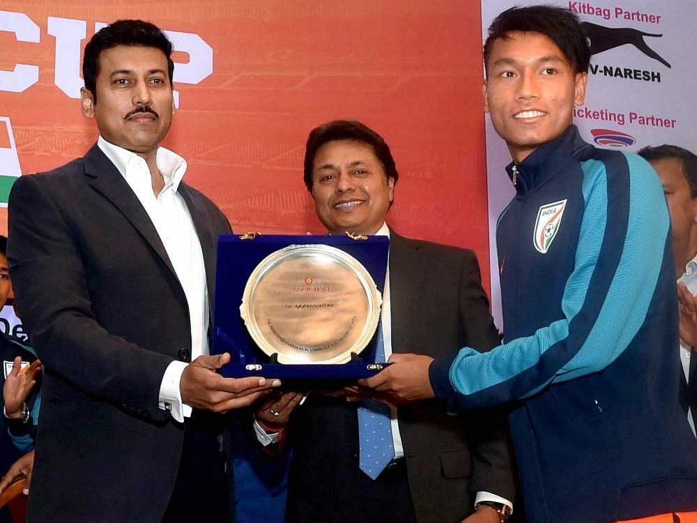 Minister of State for Youth Affairs and Sports (I/C), Rajyavardhan Singh Rathore felicitates India U-17 World Cup football team captain Amarjit Singh Kiyam during the Assocham Industry Discussion & Felicitation Sessions. PTI Photo