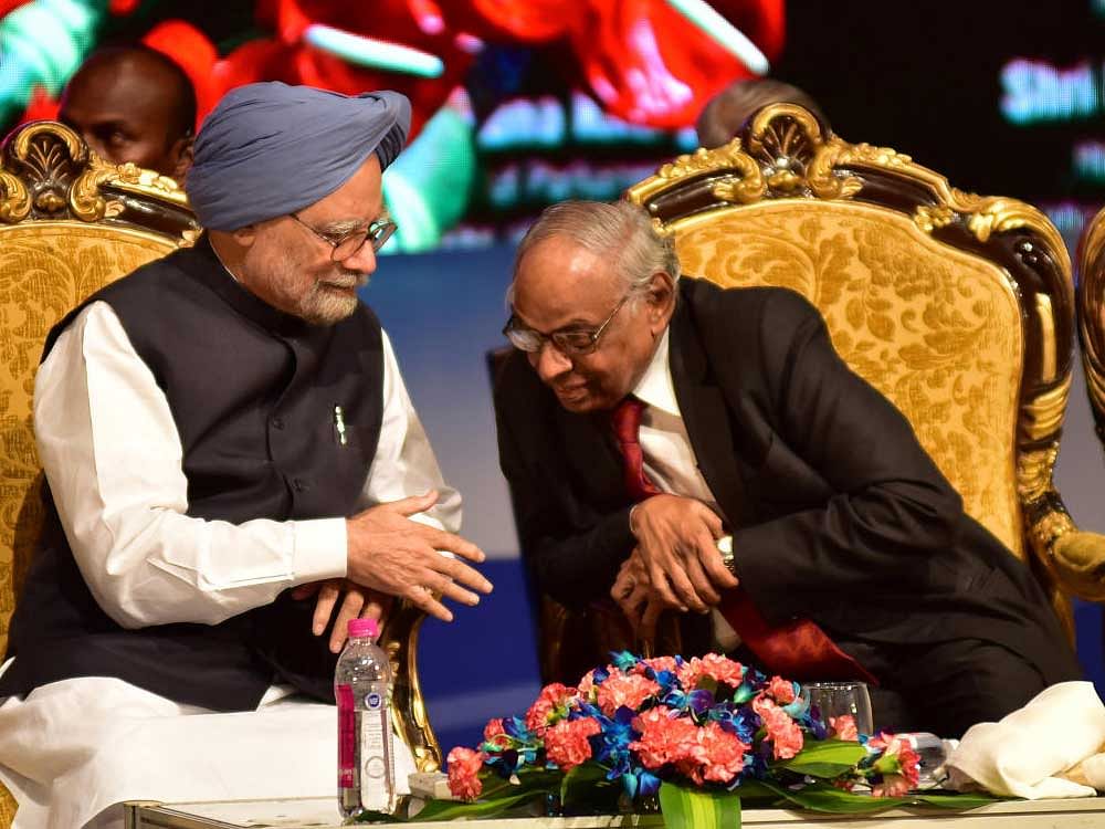 Former Prime Minister of India Dr Manmohan Singh having a word with Former Governor of RBI C Rangarajan, during inauguration of the academic session of Bengaluru Dr. B R Ambedkar School of Economics, at Ambedkar Bhavan in Bengaluru on Wednesday. Photo by B H Shivakumar