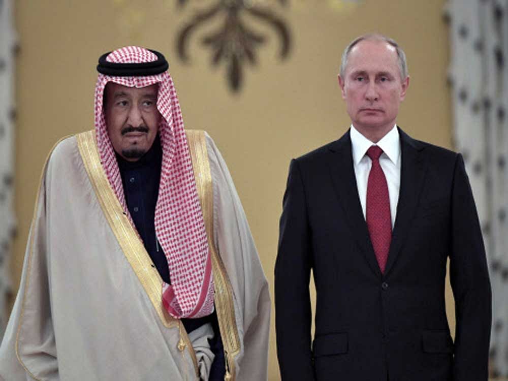Russian President Vladimir Putin and Saudi Arabia's King Salman attend a welcoming ceremony ahead of their talks in the Kremlin in Moscow. Reuters Photo