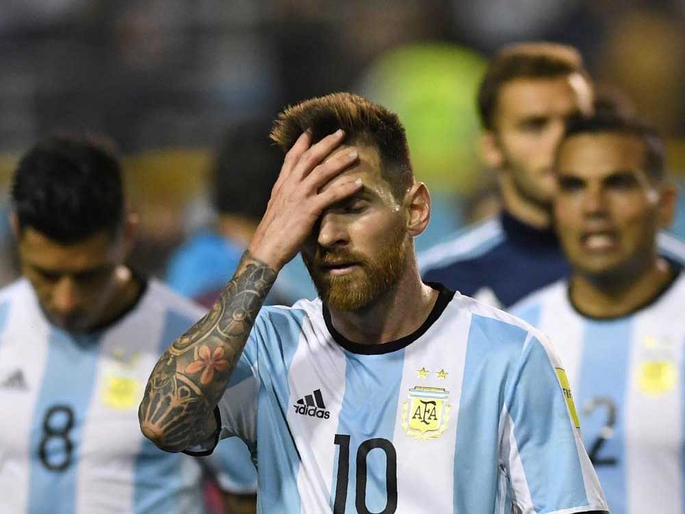 Frustrated: Argentina's Lionel Messi cuts a sorry figure after his team was held goalless by Peru on Thursday. AFP