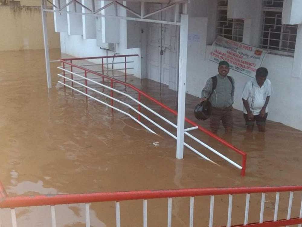 The post office in Malavalli town, Mandya district, was flooded following heavy showers on Friday.