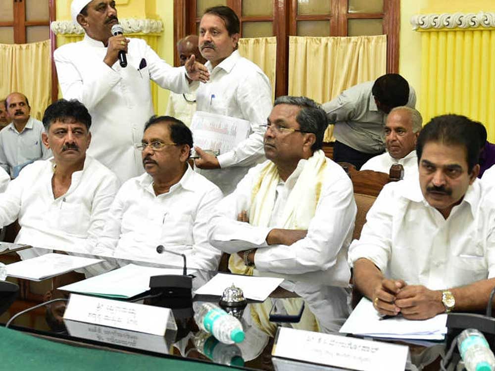 Chief minister siddaramaiah and other Congress leaders with KC Venugopalat Vidhanasoudha in Bengaluru on Friday. DH