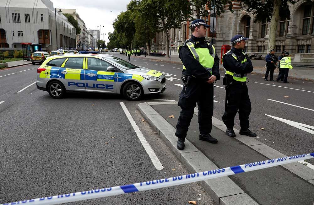 Police officers stand in the road near the Natural History Museum, after a car mounted the pavement injuring a number of pedestrians, police said, in London, Britain. Reuters/Peter Nicholls