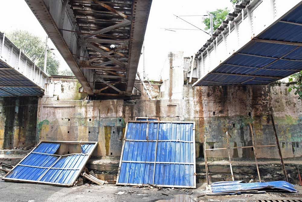 Sheets of the railway underpass near Kino theatre, off Anand Rao Circle, fell down during the Sunday morning rain. DH Photo.