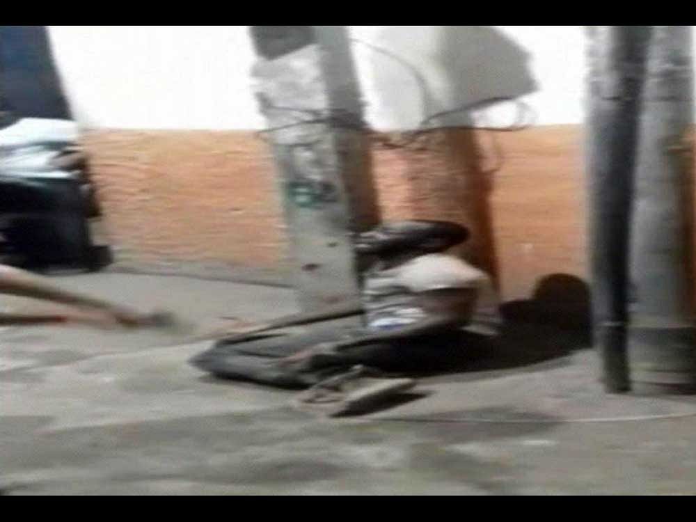 A video has surfaced in which Ahmed, who is tied to a pole, can be seen being thrashed by Kumar and some other with sticks. Screen Grab
