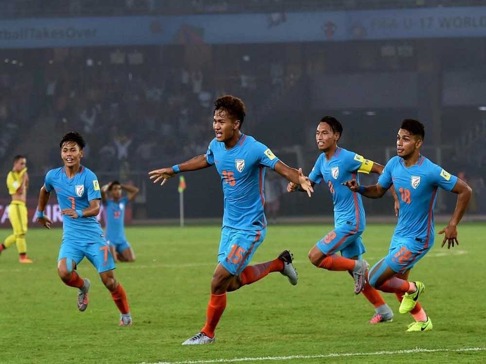 India's Jeakson Thounaojam celebrate with his teammates after scoring India's first goal during their FIFA U-17 World Cup 2017 football match against Colombia in New Delhi on Monday. PTI Photo