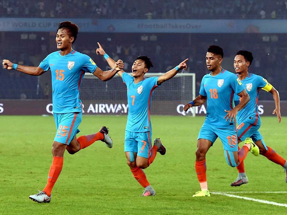 India's Jeakson Thounaojam (15) celebrates after scoring India's first goal during the FIFA U-17 World Cup 2017 football match against Colombia in New Delhi on Monday. PTI Photo