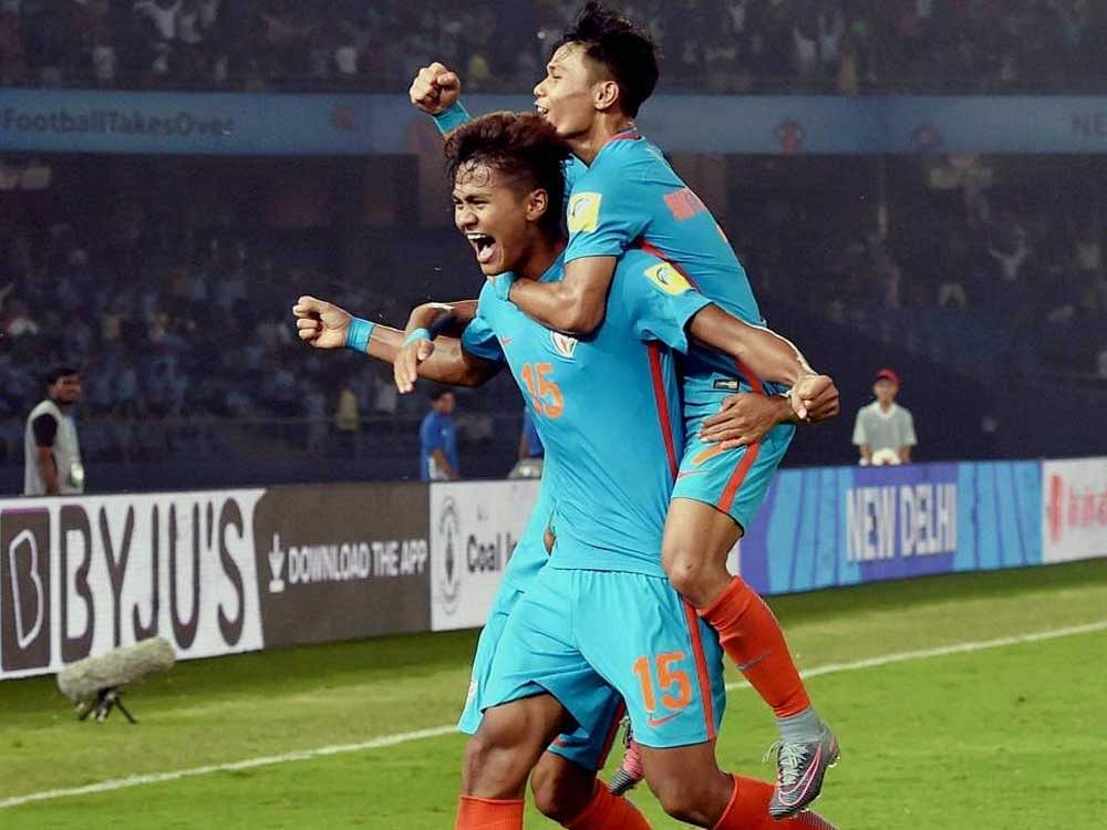 Jeakson Thounaojam Singh celebrates with teammates after scoring against Colombia in the Under-17 World Cup in New Delhi on Monday. PTI