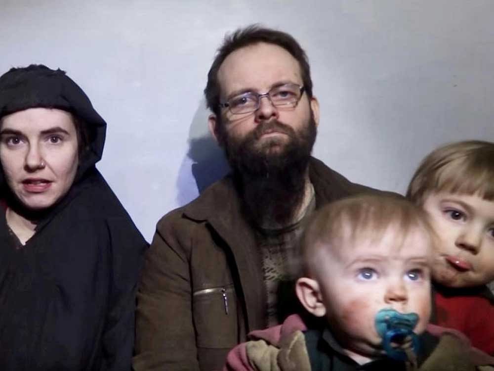 In this image from video released by Taliban Media in December 2016, Caitlan Coleman talks in the video while her Canadian husband Joshua Boyle holds their two children. U.S. officials said Pakistan secured the release of Coleman of Stewartstown, Pa., and her husband, who were abducted five years ago while traveling in Afghanistan and then were held by the Haqqani network. Coleman was pregnant when she was captured. The couple had three children while in captivity, and all have been freed, U.S. officials said. AP/PTI