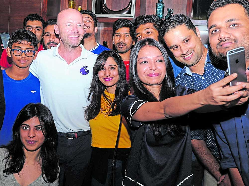 ONE FOR THE ALBUM Football fans take a selfie with Alan Shearer at an event in Bengaluru. DH Photo /Srikanta Sharma R