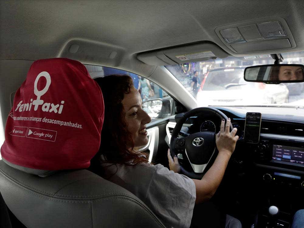 Taxi driver Priscila Galante drives her car in a main street in Sao Paulo, Brazil. Reuters