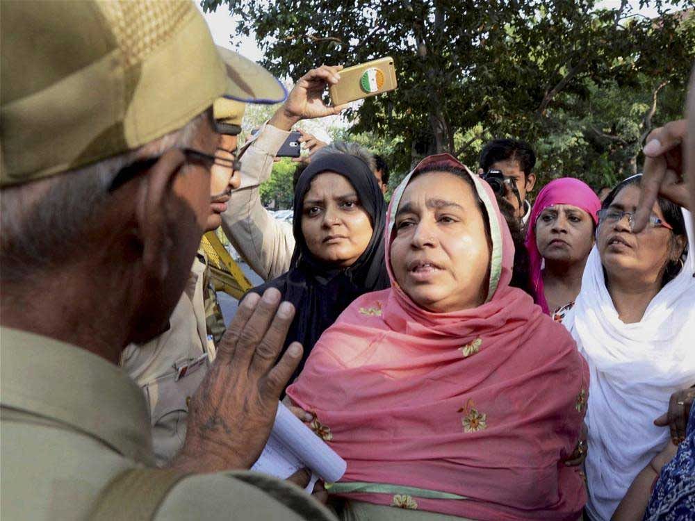 Najeeb's mother Fatima Nafees and JNU students were protesting outside the high court and they were detained when they tried to enter its premises, police sources said. PTI