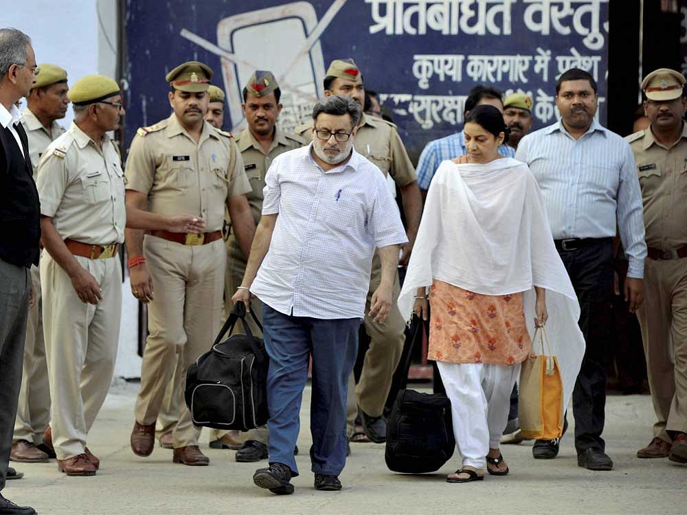 Dentist-couple Nupur and Rajesh Talwar coming out of the Dasna Jail in Ghaziabad. PTI Photo