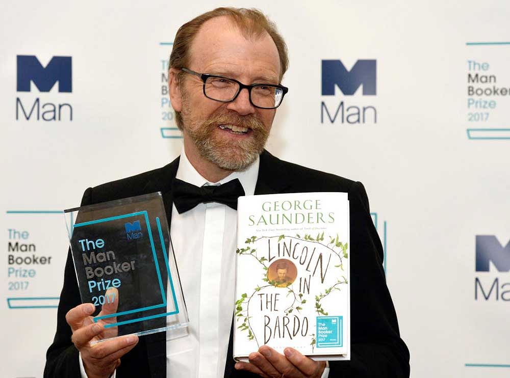 George Saunders, author of 'Lincoln in the Bardo', poses for photographers after winning the Man Booker Prize for Fiction 2017 in London. Reuters