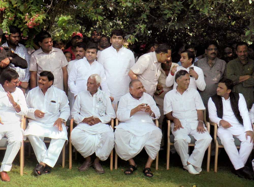:Samajwadi Party founder Mulayam Singh Yadav and party president Akhilesh Yadav, Shivpal Singh Yadav and other family members during the Diwali celebration at his residence in Etawah on Thursday.PTI Photo