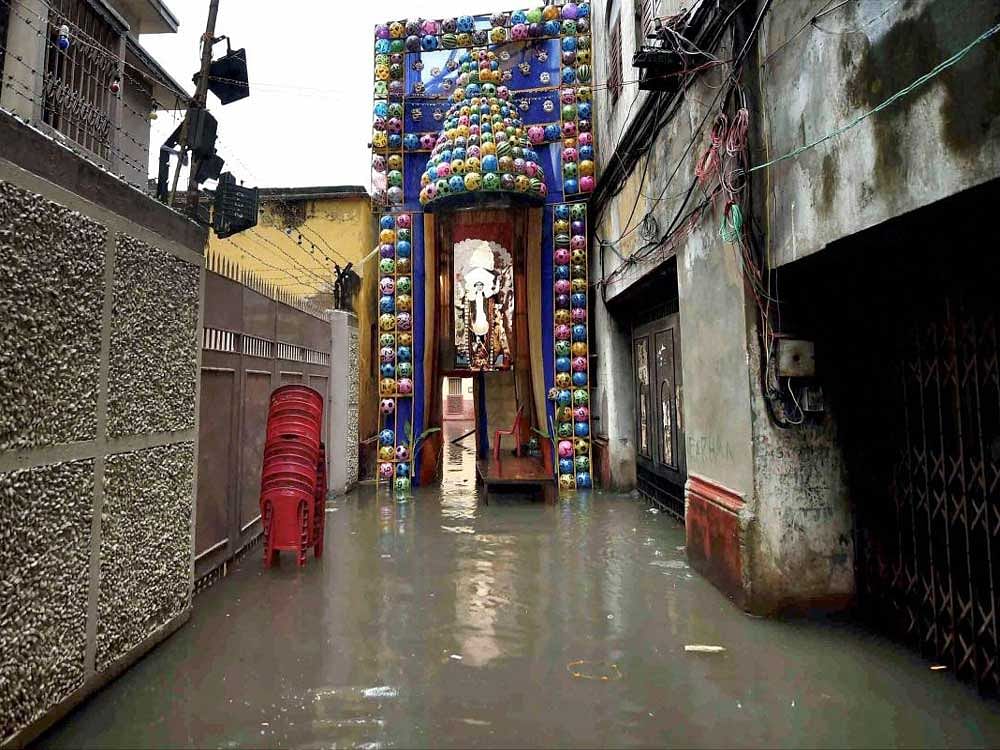 A community Kali puja pandal in Kolkata is waterlogged on Friday morning following a night of heavy rain. PTI
