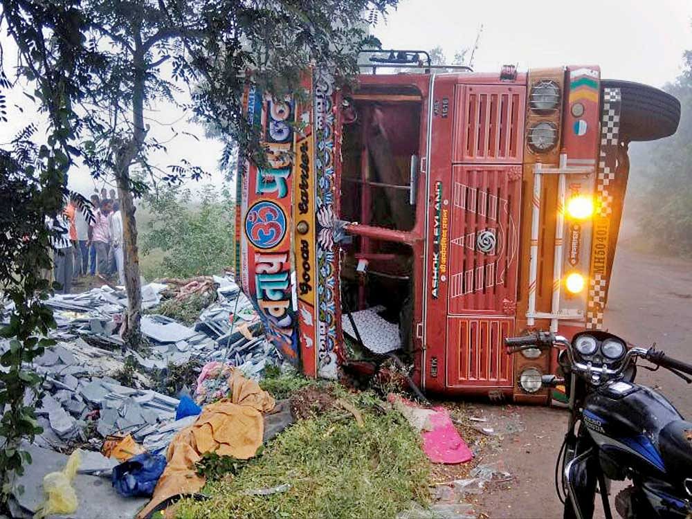 A truck ferrying labourers overturned near Manerajuri village in Sangli on Saturday wee hours killing 10 and injuring 20 others in this accident. PTI Photo