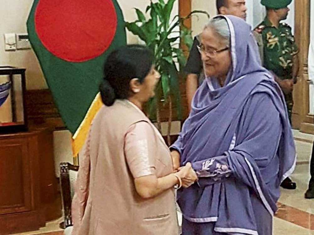 External Affairs Minister Sushma Swaraj greets Bangladesh Prime Minister Sheikh Hasina in Dhaka on Sunday. PTI