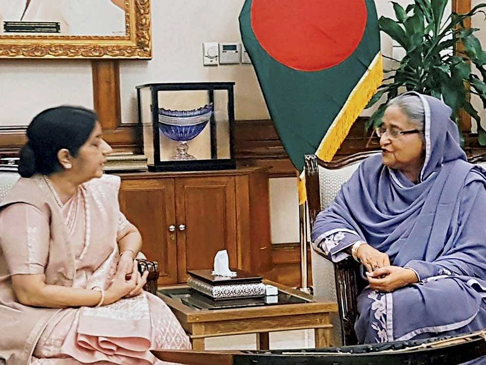 External Affairs Minister Sushma Swaraj with Bangladesh Prime Minister Sheikh Hasina at a meeting in Dhaka on Sunday. PTI Photo