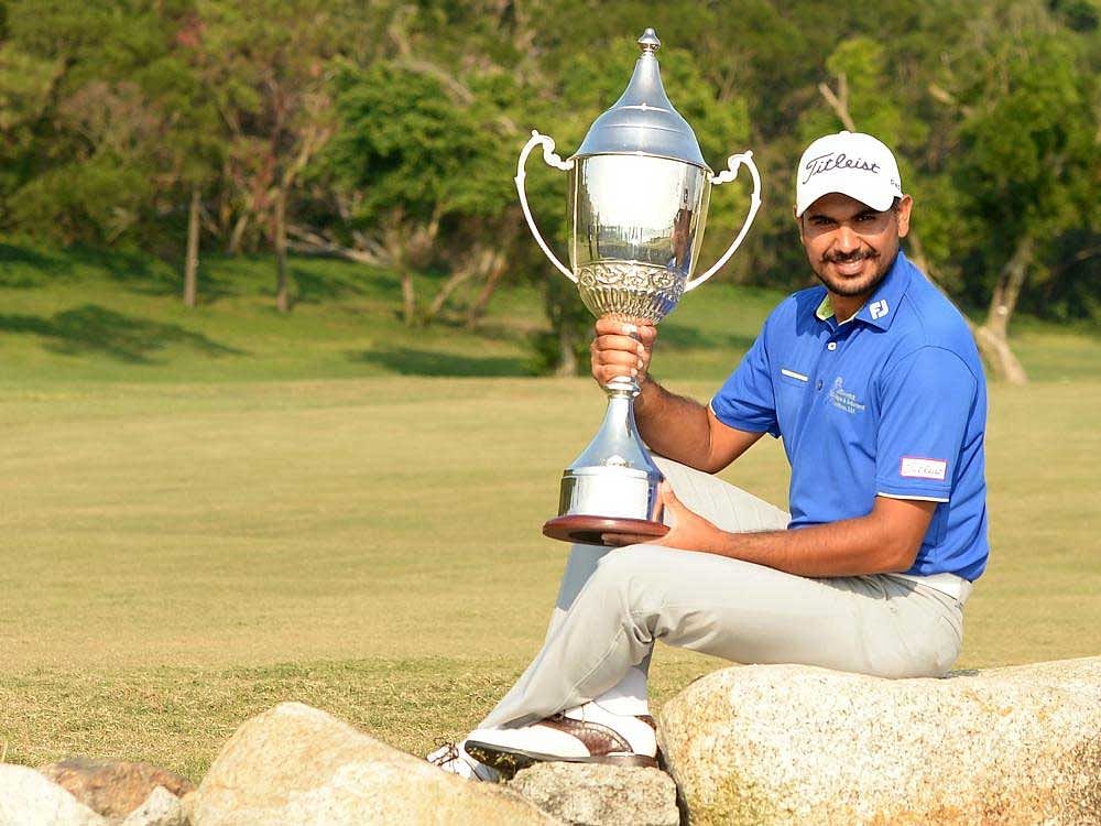 India's Gaganjeet Bhullar is all smiles after winning his second Macau Open title on Sunday. AFP