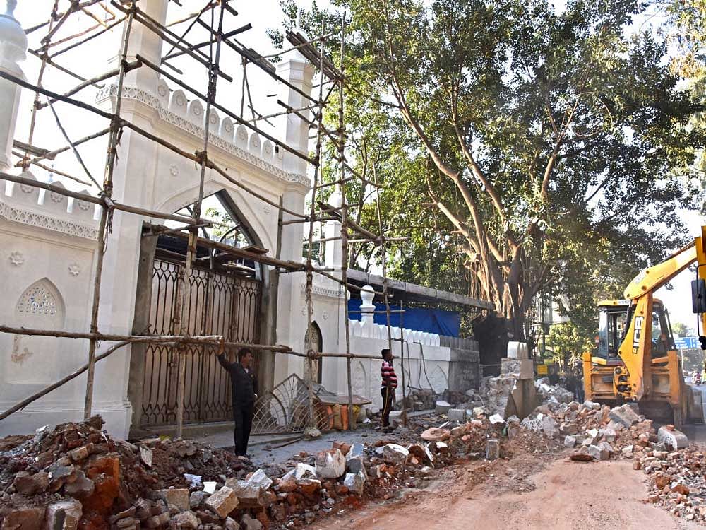BBMP demolishing Shia Mosque compound wall for Road widening, after handover the land from Masjid e Askari and Shia Qabrastan Managing committee at Hosur Road near Johnson Market, Richmond town in Bengaluru on Sunday. Photo by S K Dinesh