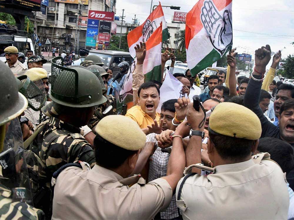 Congress workers being whisked away by police during a demonstration against BJP MP Kamakhya Prasad Tasa's controversial remarks, in front of Rajiv Bhawan in Guwahati on Sunday. PTI Photo