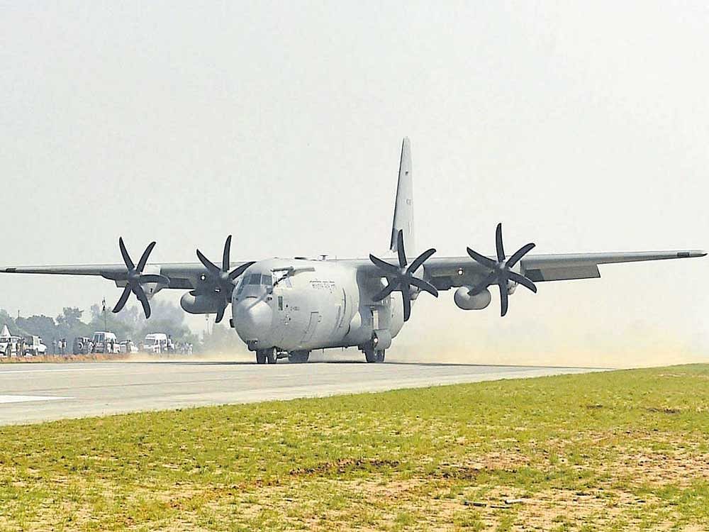 Transport aircraft C-130 Hercules lands on the Lucknow-Agra Expressway during an IAF drill near Bangarmau in Unnao district of Uttar Pradesh on Tuesday. PTI