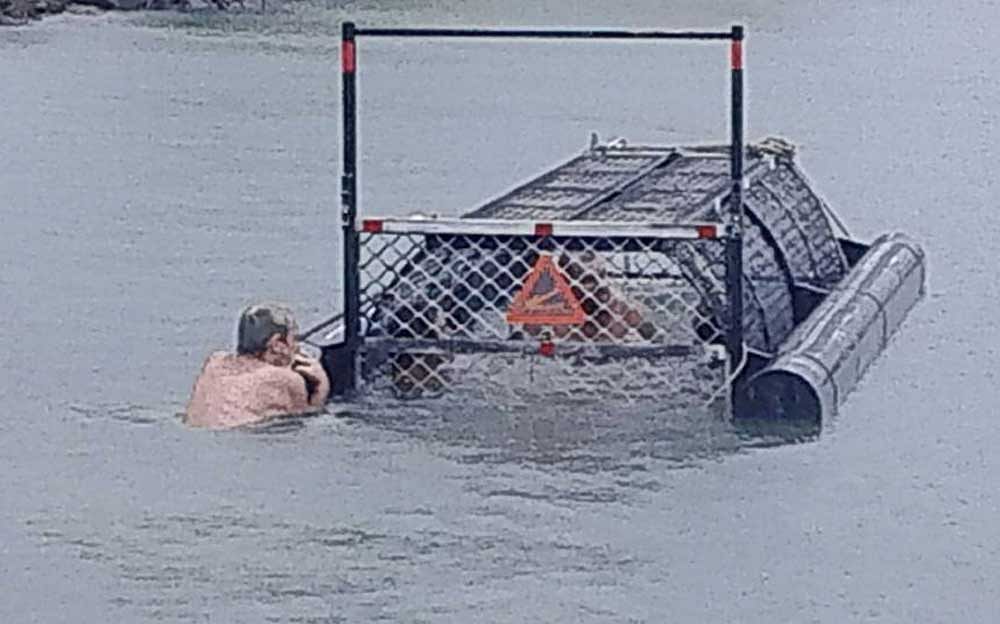 The men were bashed as 'idiots of the century' for swimming into a baited croc trap, which also happens to be a punishable offence in Australia. Facebook photo.