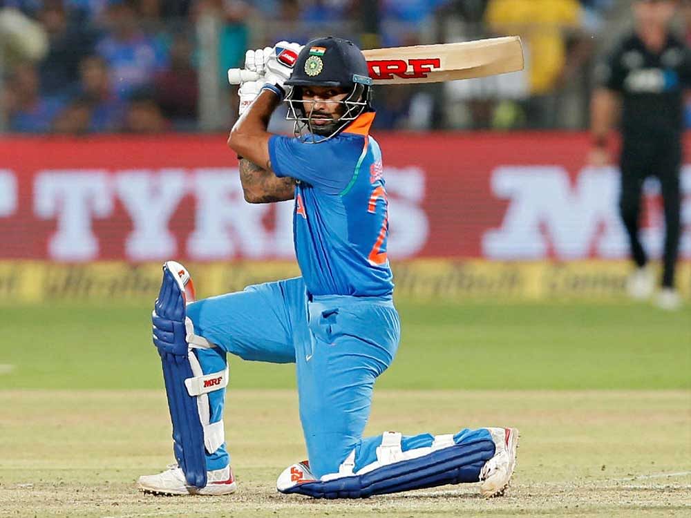India's Shikhar Dhawan cuts one to the boundary during his half-century. REUTERS