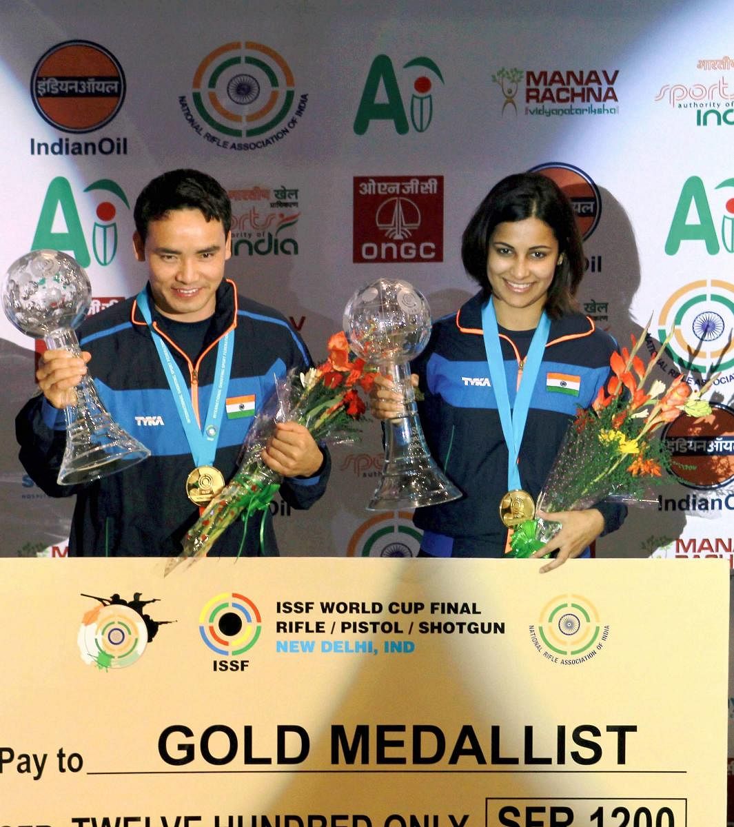 India's Jitu Rai and Heena Sidhu at the award presentation ceremony after winning the gold in Mixed team 10M Air Pistol event at ISSF World Cup Final 2017 at Dr Karni Singh Shooting Range in New Delhi on Tuesday.