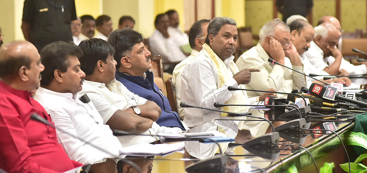 Chief Minister Siddaramaiah, accompanied by senior  ministers, defends Bengaluru Development Minister  K J George at a press conference in Bengaluru on  Friday.