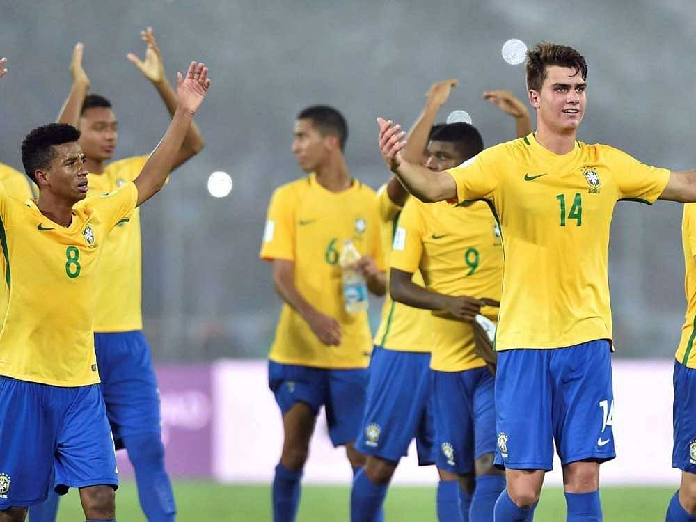 Brazil footballers exchange greetings with spectators after winning match against Mali during FIFA U-17 World cup in Kolkata on Saturday. PTI Photo