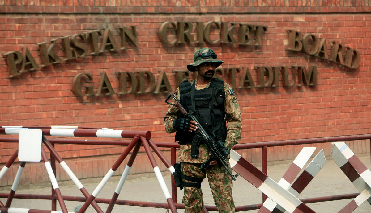 A Pakistani soldier stands guard outside the Gaddafi Cricket Stadium ahead of a Twenty20 international cricket match between Pakistan and Sri Lanka in Lahore, Pakistan October 28, 2017. REUTERS/Mohsin Raza