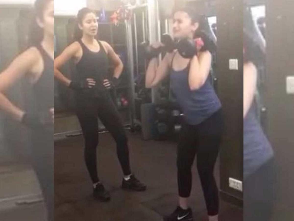 The 34-year-old actor shared a video on Instagram in which she is seen pushing Alia to do 300 squats with weights in absence of their trainer. Credit: Instagram/katrinaKaif