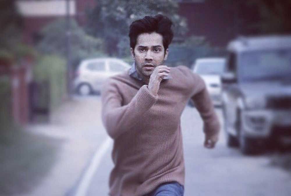 The textless poster shows Varun Dhawan running, possibly away from someone. Twitter photo.