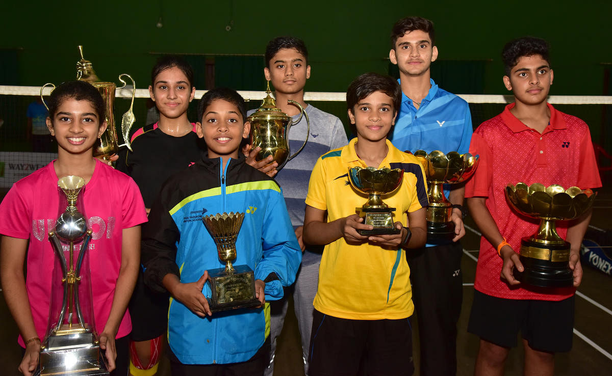 Singles Winners of the Ramaiah Rajan Memorial CUCT State Ranking Badminton Tournament at Canara Union in Bengaluru on Tuesday. (L to R &ndash;Front row) Negsa Cariyappa(GS U-13), Tushar S (BS U-13), Vijetha(GS U15), Suhas V (BS U -15) (Back row From Left) Driti Yateesh(GS U- 17), Shamanth Rao (BS U-19) and Nithin H V (Bs U -17) are seen with trophy.Photo/ B H Shivakumar