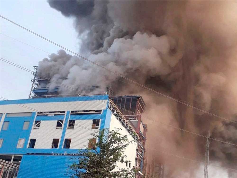 Smoke billowing out of NTPC's Unchahar Power Plant where a blast took place in a boiler, in Raebareli district on Wednesday. At least ten people are feared dead and several others have been injured after a boiler went off at the plant. PTI Photo