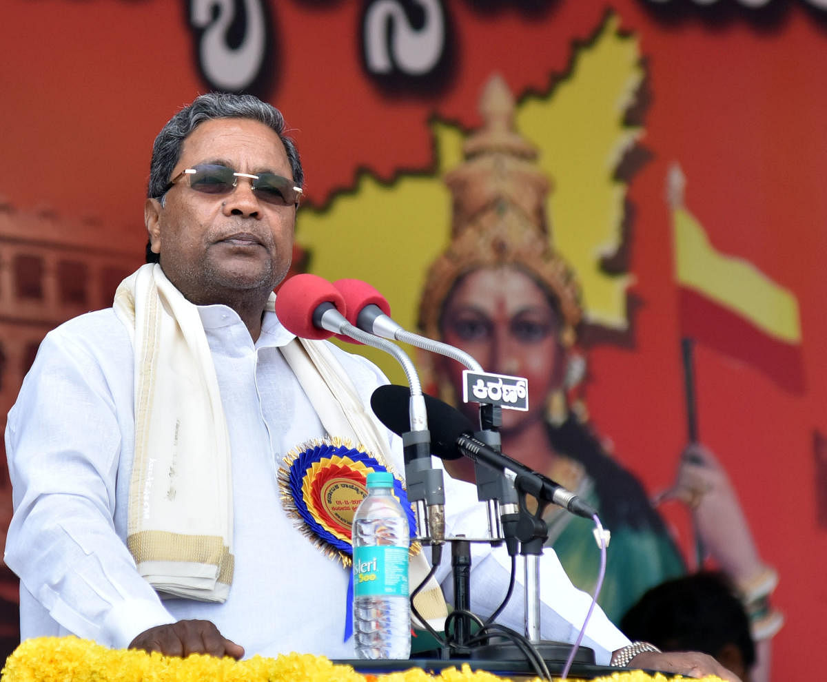 Chief Minister Siddaramaiah addressing at the Kannada Rajyostava program at Sree Kanteerava Stadium in Bengaluru on Wednesday. DH