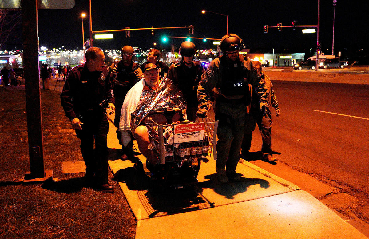 An injured person is evacuated in a Walmart cart by SWAT medics from the scene of a shooting at a Walmart in Thornton, Colorado. Reuters