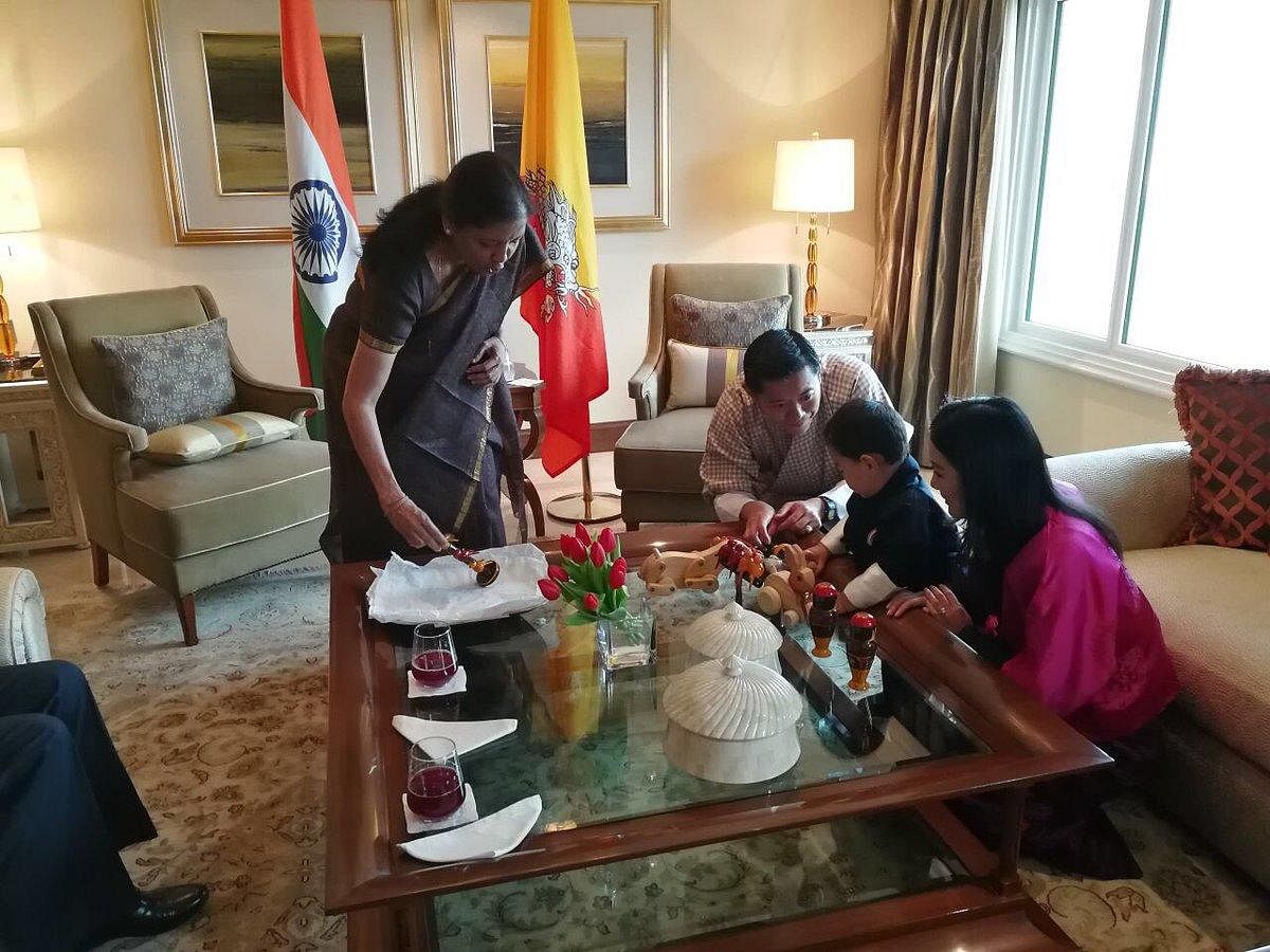 Defence Minister Nirmala Sitharaman gifts Chennapatana toys to young prince of Bhutan Jigme Namgyel Wangchuck in New Delhi on Thursday. The royal couple look on. Image credit: Twitter/Nirmala Sitharaman