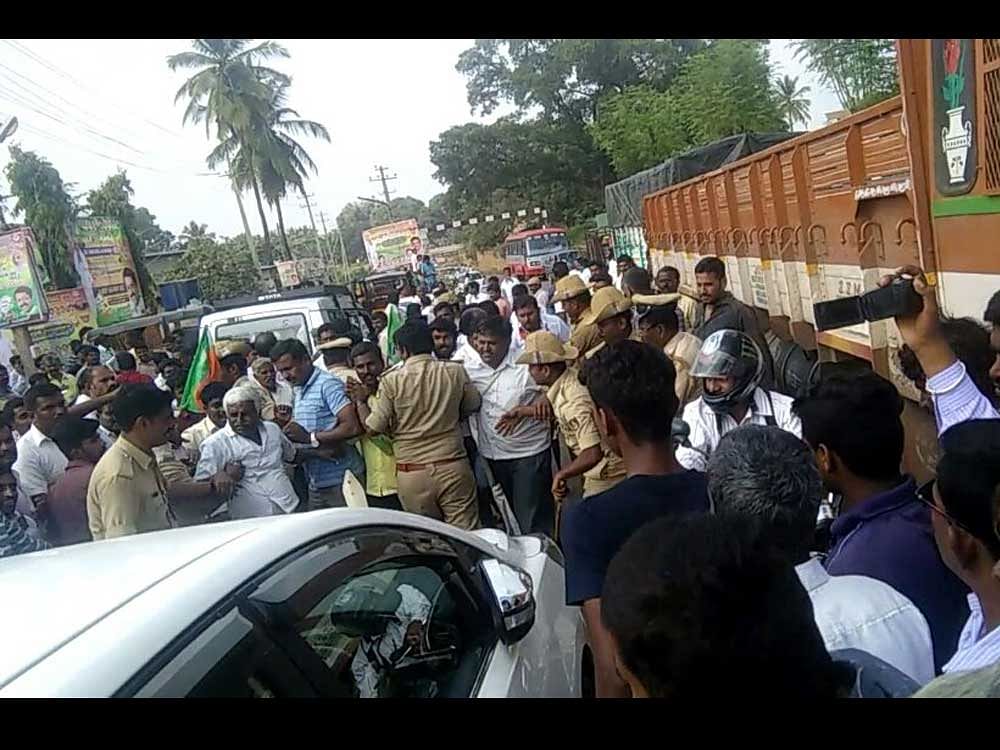 The vehicle was attacked by the supporters of sacked BJP leader Chaudary Nagesh. DH Photo