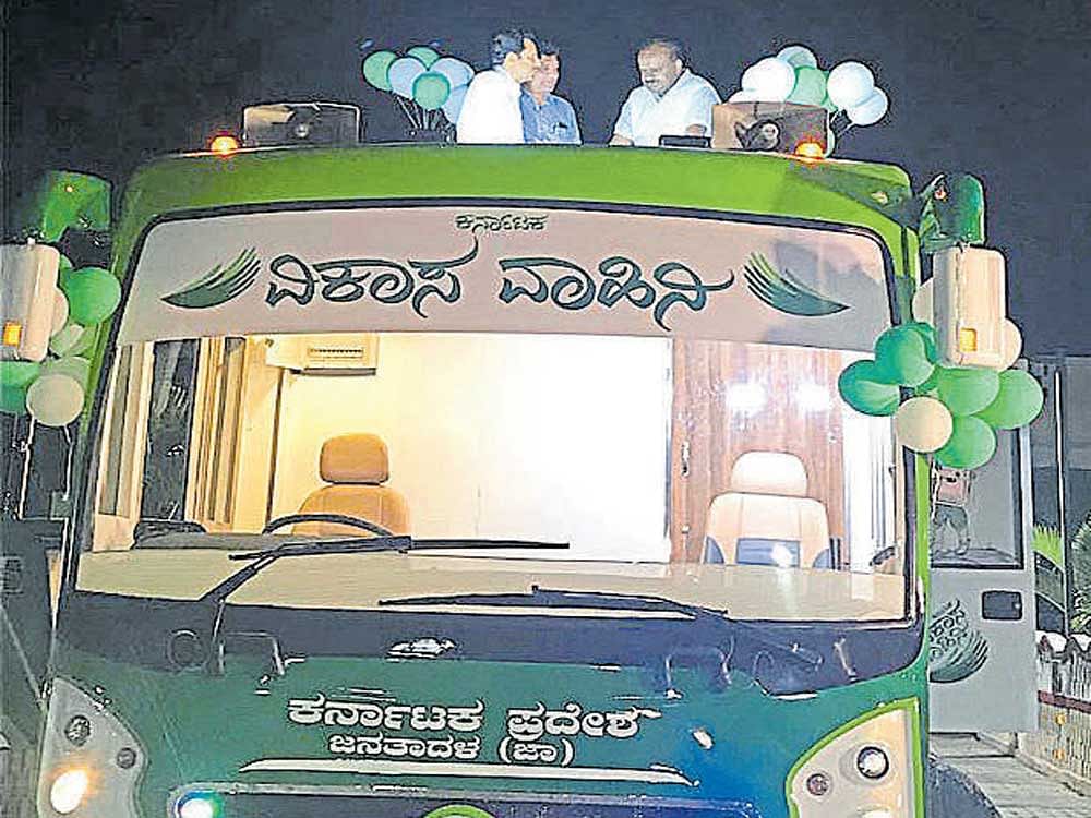 JD(S) state president H D Kumaraswamy inspects the campaign bus in Bengaluru on Friday.