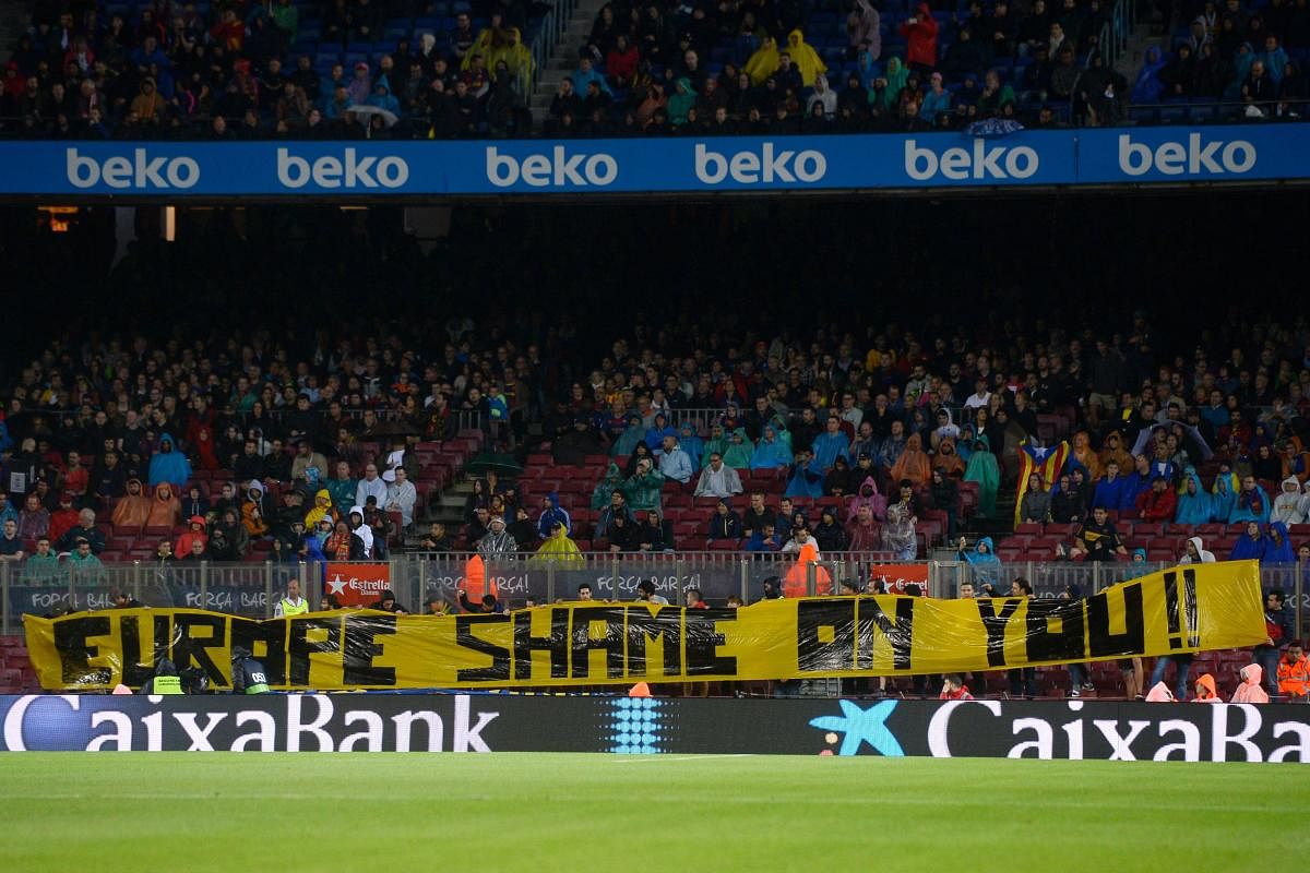 Barcelona supporters register their protest with a banner reading 'Europe, Shame on You' in reference to the Catalan political crisis during the La Liga tie between FC Barcelona and Sevilla FC at the Camp Nou. AFP