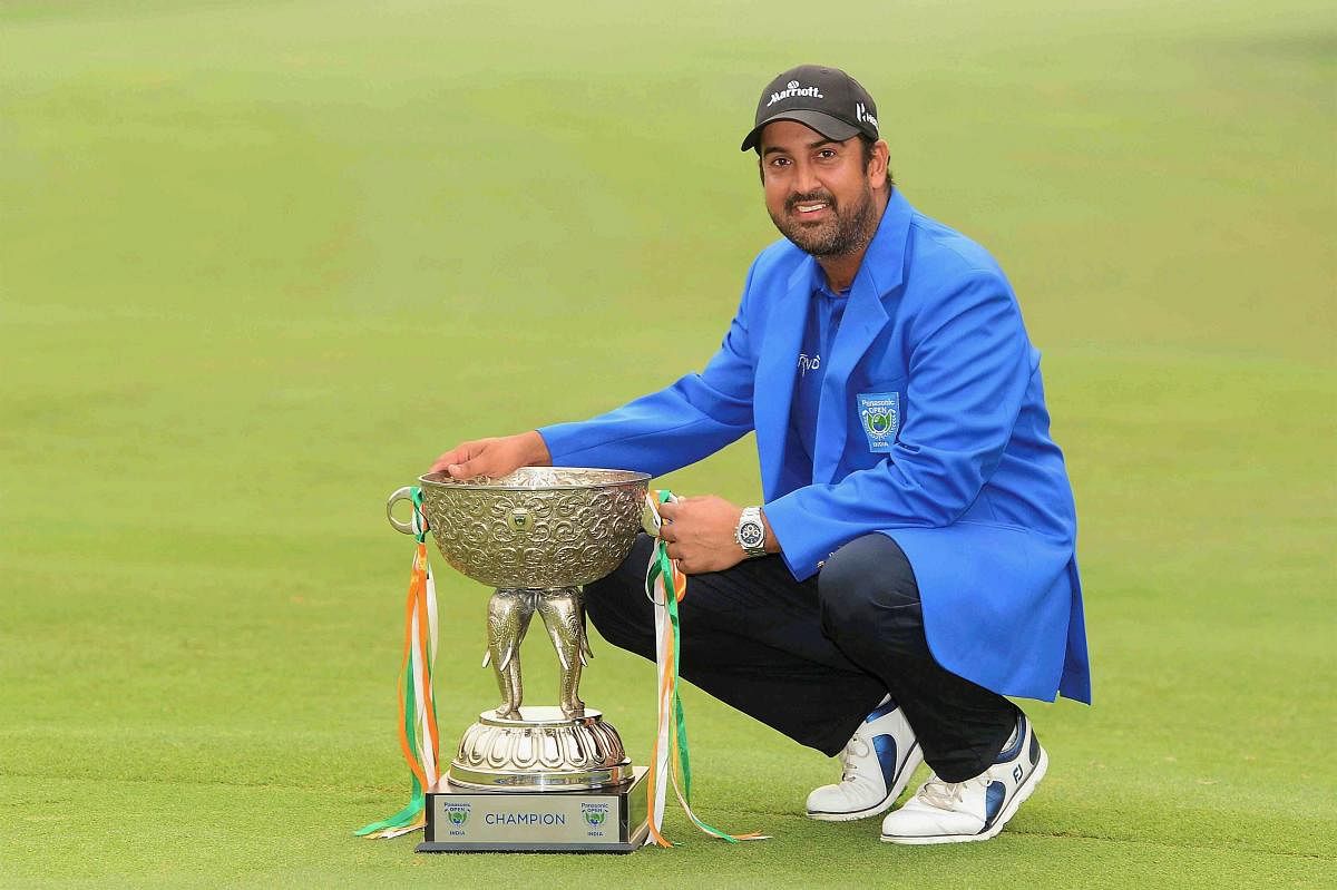ELATED Shiv Kapur with his spoils after winning the Panasonic Open on Sunday. PTI