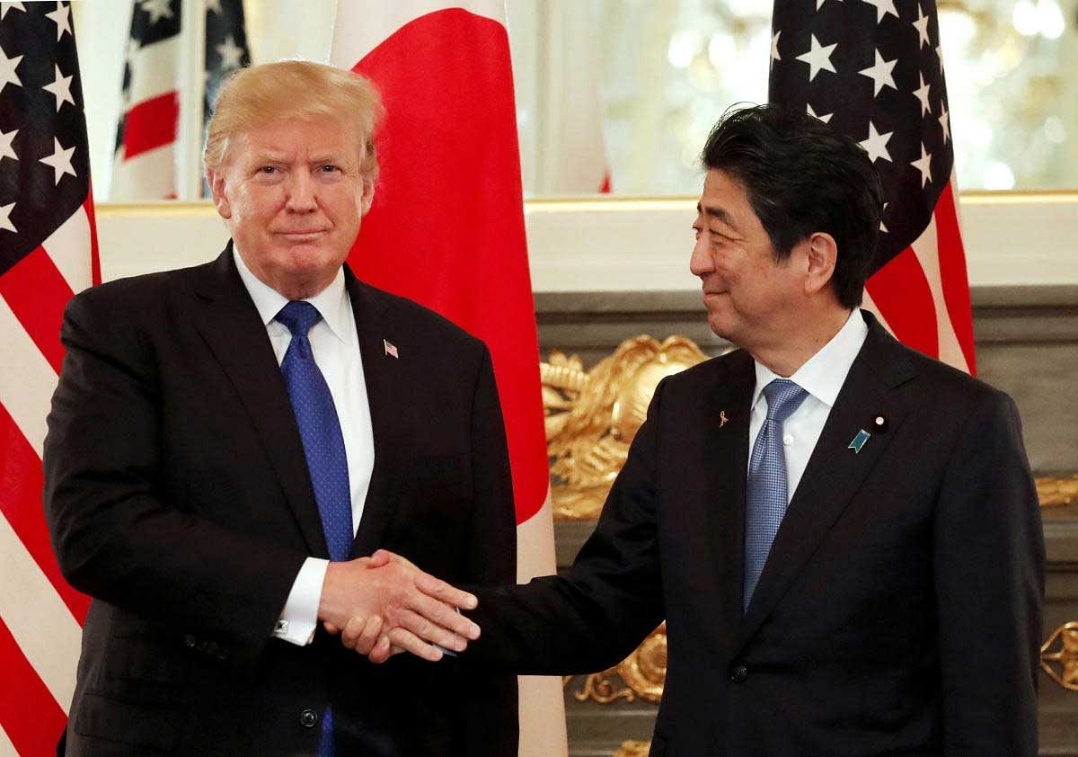 U.S. President Donald Trump and Japan's Prime Minister Shinzo Abe shake hands before a working lunch at Akasaka Palace in Tokyo, Japan November 6, 2017. REUTERS