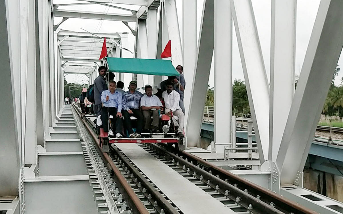 Railway officials inspect the new double track in Srirangapatna, Mandya district on Monday.