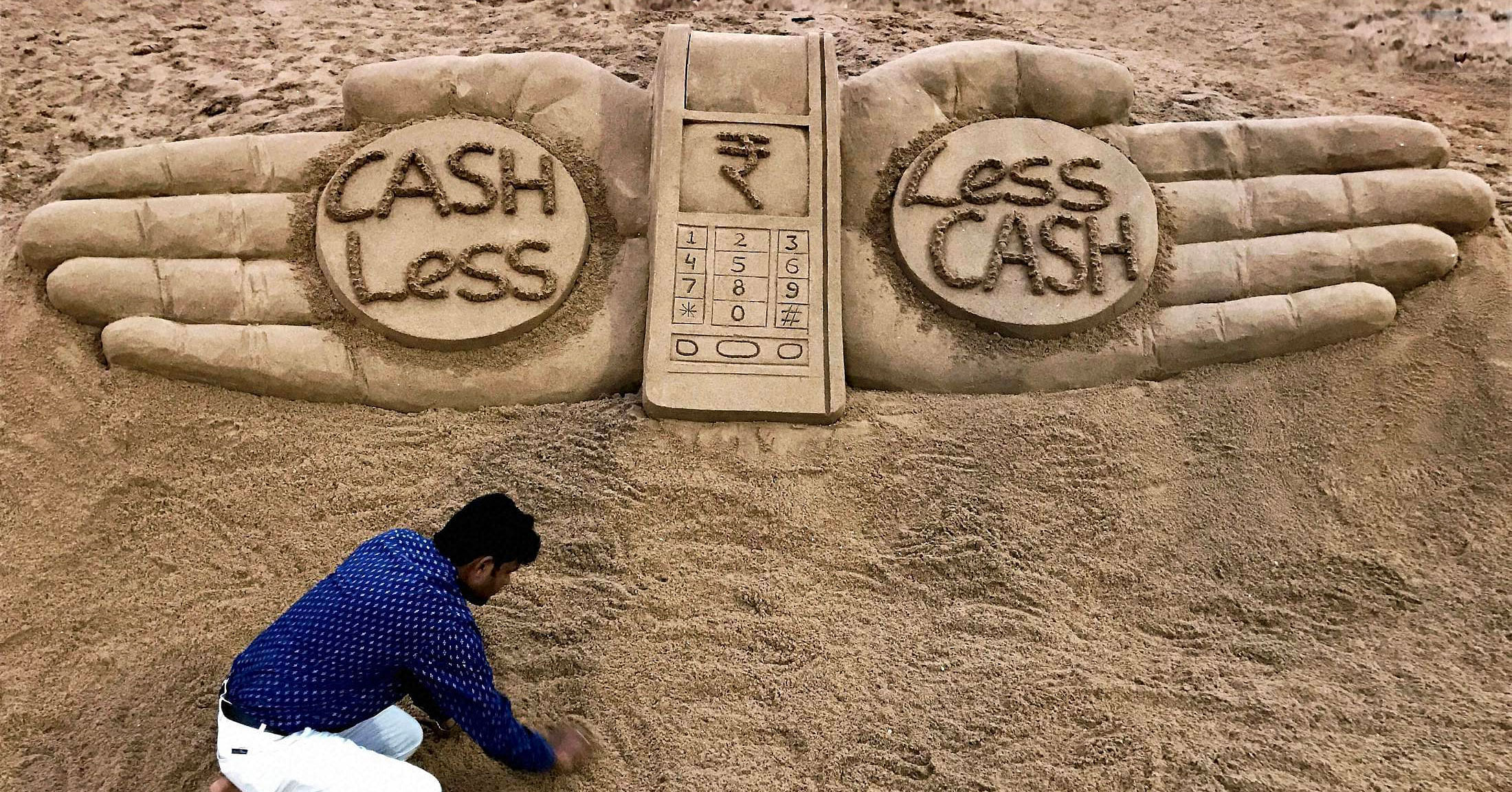 Sudarshan Patnaik's sand art on demonetisation. PTI file photo