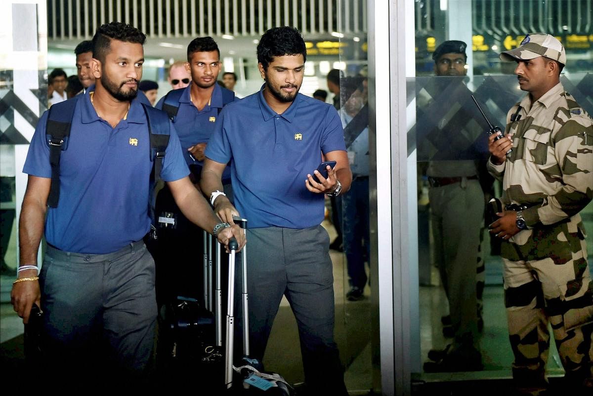SETTING FOOT Sri Lankan captain Dinesh Chandimal (centre) arrives with his team-mates in Kolkata on Wednesday. PTI
