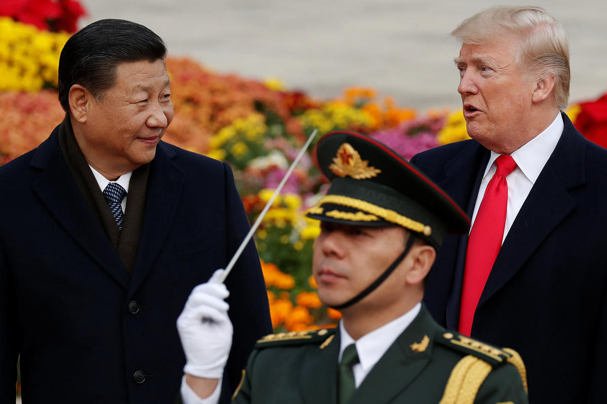 U.S. President Donald Trump takes part in a welcoming ceremony with China's President Xi Jinping at the Great Hall of the People in Beijing. REUTERS Photo